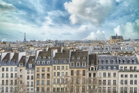 Photo for Paris, typical buildings in the Marais, aerial view with the Saint-Eustache church, the Eiffel Tower and the Defense in background - Royalty Free Image