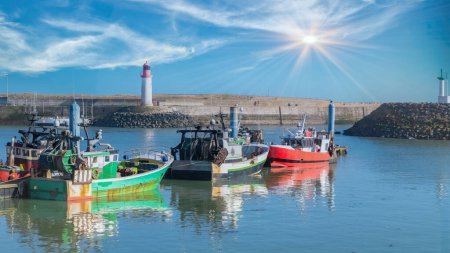 Oleron island in France, the typical harbor of the Cotiniere, with the lighthouse and fishing boats