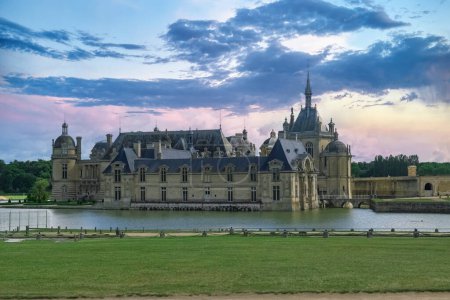 Photo for Chantilly castle, in France, beautiful palace with a lake - Royalty Free Image