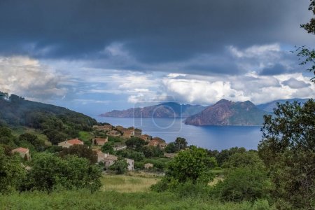 Photo for Corsica, the Piana village and creeks, beautiful seascape in summer, in the mist - Royalty Free Image