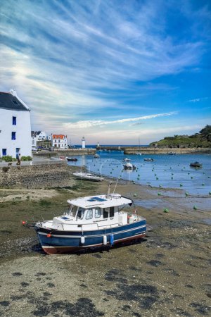 Sauzon in Brittany, the typical harbor with bots and lighthouse