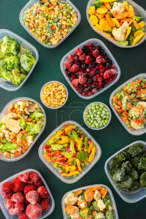 Photo for Food in winter, freezing fresh vegetables in summer in the refrigerator for winter, various frozen vegetables in plastic dishes, top view, background of containers with vegetables - Royalty Free Image