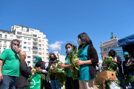 Photo for Buenos Aires, Argentina, 21 sept, 2021: UTT, Union de Trabajadores de la Tierra, Land Workers Union, gave free organic food, fruits and vegetables to draw attention to the need of the Land Access Law. - Royalty Free Image