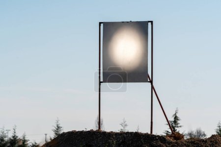 Photo for Large, flat, sun-tracking mirrors known as heliostats focus sunlight onto a receiver at the top of a tower. Heliostat test runs. - Royalty Free Image