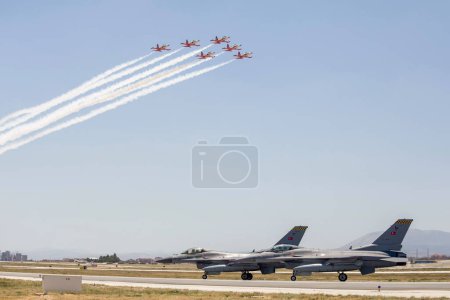 Photo for Konya, Turkey - 07 01 2021: Anatolian Eagle Air Force Exercise 2021 2 F16 fighter jets taxi in Turkey as Turkish Stars aerobatic team passes through the sky - Royalty Free Image
