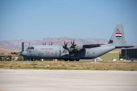 Photo for Konya, Turkey - 07 01 2021:Members of Iraqi Air Force Squadron 24 prepare for the Anatolian Eagle Exercise 2021 training flight with an Iraqi C-130J Hercules - Royalty Free Image