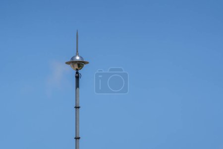 Photo for Lightning rod on the roof of a building against a blue sky. Lightning strike - Royalty Free Image