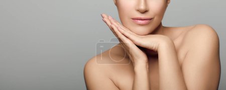 Photo for Beauty and Skin Care Concept. Beautiful natural young woman face with flawless fresh clean skin. Panorama banner with lateral grey copyspace - Royalty Free Image