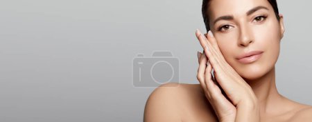 Photo for Beauty and Skin Care Concept. Beautiful natural woman with clean healthy luminous skin. Panorama banner with lateral grey copyspace. - Royalty Free Image