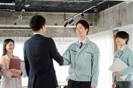 Photo for Businessman and worker shaking hands in the office - Royalty Free Image