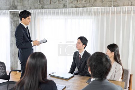 Businessman training new employees in the office