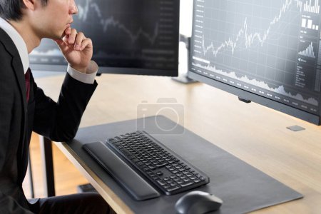 Photo for Hand of a businessman checking stock prices - Royalty Free Image