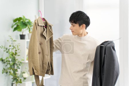 A man organizing his clothes