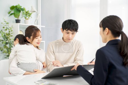 A family receiving information about insurance