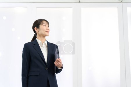 woman looking up in office