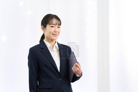 Portrait of a woman standing in the office