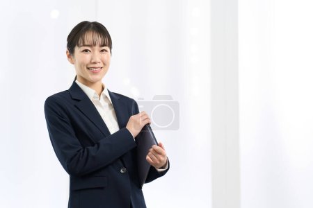 Portrait of a woman standing in the office