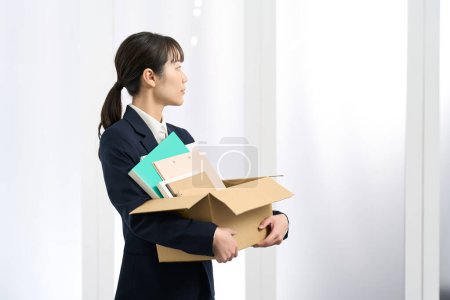 Business woman moving with luggage