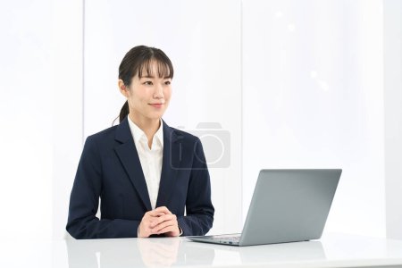 Asian business woman interviewing customers