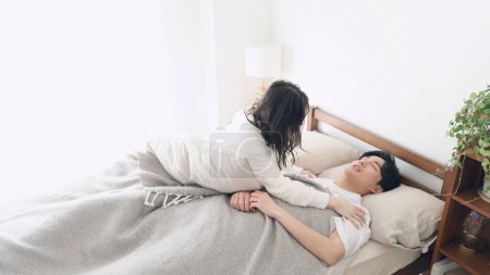 A woman worried about her husband's apnea