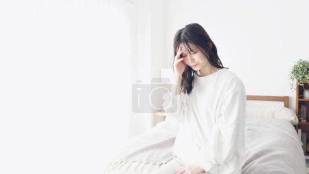 A woman suffering from a headache