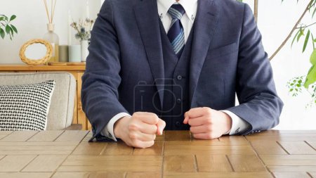 Businessman getting angry and hitting the table