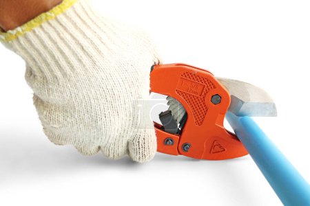 Hand Holding Pipe Cutter Cutting PVC Pipe on white background