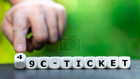 Téléchargez les photos : Dice form the expression '49 EUR Ticket'. Symbol for a monthly ticket for public transport in Germany starting in May 2023. - en image libre de droit