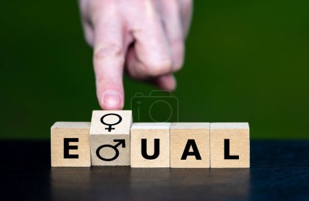 Foto de The two gender symbols of men and women used to form the word equal. Symbol that both gender have equal rights. - Imagen libre de derechos