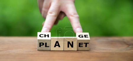 Change the planet concept. Wooden cubes form the words planet and change.