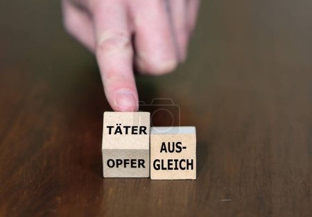 Holzwürfel bilden den deutschen Ausdruck "Opfer-Täter-Ausgleich").