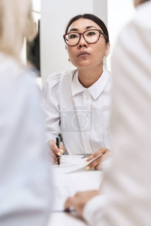 Photo for Portrait of young Asian business woman during meeting - Royalty Free Image