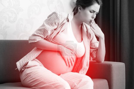 Photo for Pregnant woman at home feels sick. Different health problems during pregnancy. - Royalty Free Image