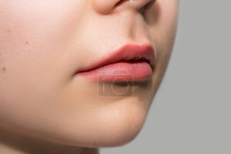Photo for Closeup of female lips after permanent makeup lip blushing procedure - Royalty Free Image