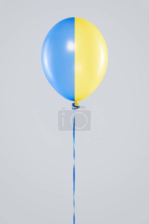 Photo for Lonely balloon in colors of Ukrainian flag. Different concepts and ideas. - Royalty Free Image