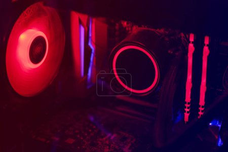 Photo for Closeup of inside parts of gaming personal computer with neon light - Royalty Free Image