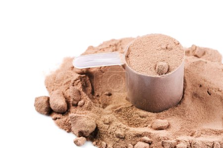 Closeup of scoop with chocolate whey protein or mass gainer powder 