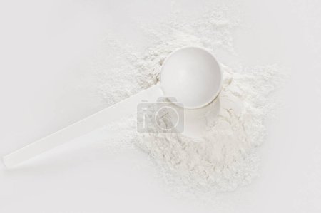Photo for Closeup of scoop with creatine monohydrate supplement - Royalty Free Image