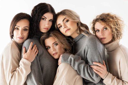 Photo for Group of different women wearing turtleneck jumpers on gray background. Diversity, friendship and other concepts. - Royalty Free Image