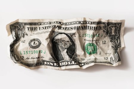Photo for Closeup shot of a crumpled worn out one dollar bill. Concept of financial crisis and poverty. - Royalty Free Image