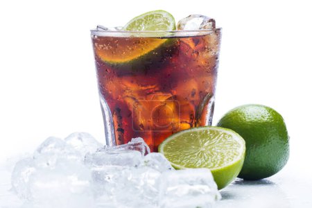 Photo for Glass of cold Cuba Libre highball cocktails or coke with ice cubes on white background - Royalty Free Image