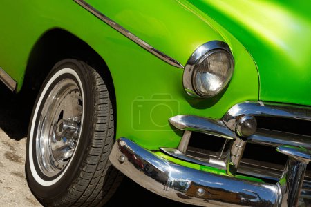 Photo for Close up of a shiny vintage green car parked on street. - Royalty Free Image