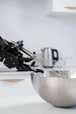Photo for Real robot hand and stainless steel whisk. Concept of robotic process automation. - Royalty Free Image