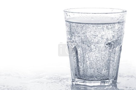Photo for Glass of sparkling soft drink or carbonated water against white background. - Royalty Free Image