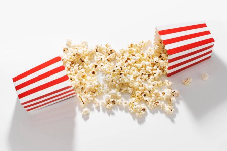 Photo for Classic striped buckets with delicious popcorn on white background. - Royalty Free Image