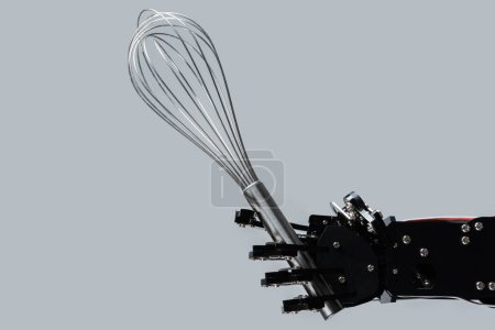 Photo for Real robot hand and stainless steel whisk on grey background. Concepts of robotic process automatization. - Royalty Free Image