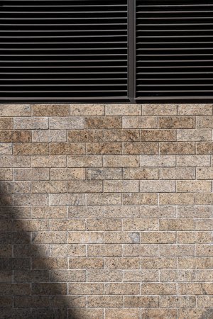 Photo for Modern brick wall with ventilation grilles providing a unique backdrop for design - Royalty Free Image