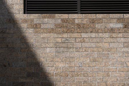 Photo for Modern brick wall with ventilation grilles providing a unique backdrop for design - Royalty Free Image