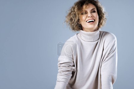 Photo for Studio portrait of a stylish young woman wearing a turtleneck jumper. - Royalty Free Image