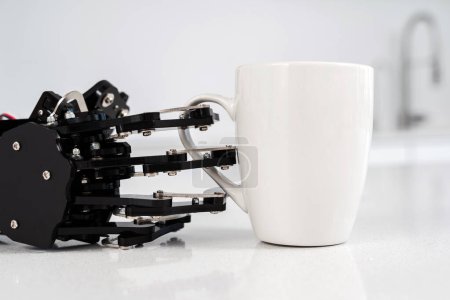 Photo for Real robot hand  and white cup of coffee. Concept of  robotic process automation. - Royalty Free Image